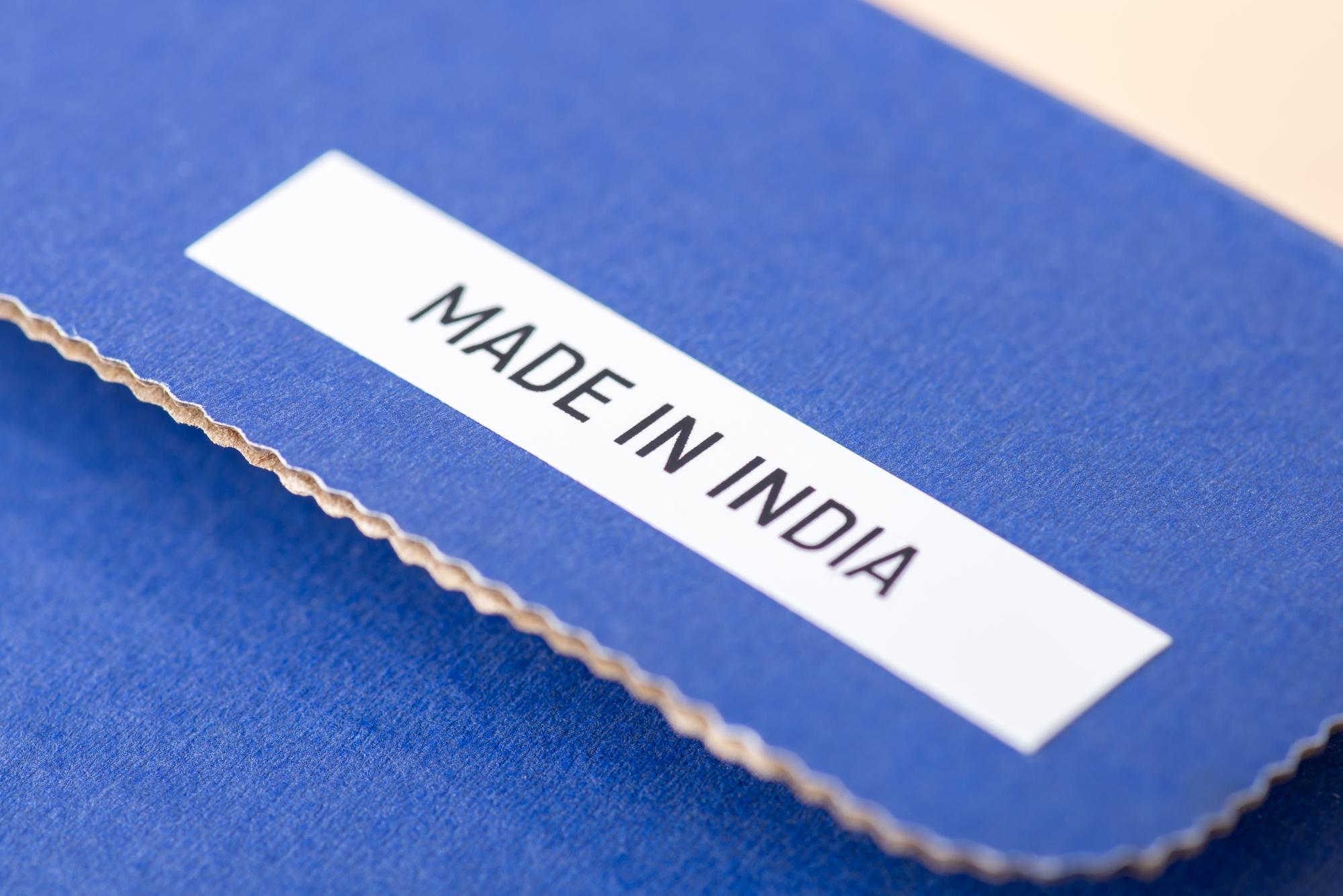 Packaging label with embroidered patch